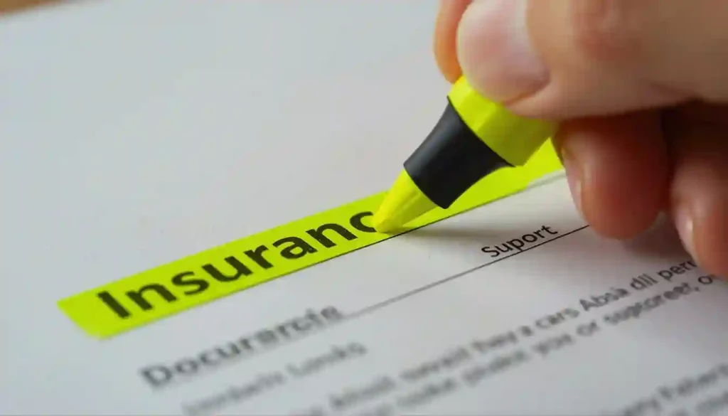 A traveler highlighting the excess waiver clause on a zero deductible Schengen visa travel insurance document.